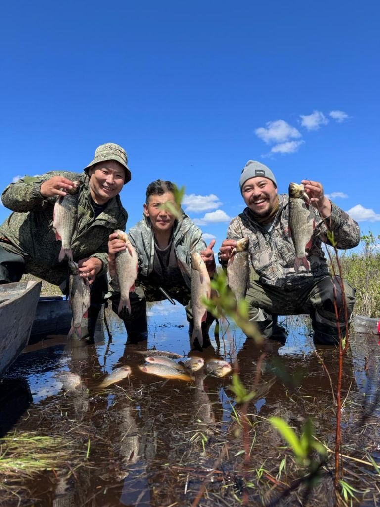 Group celebrating a successful fishing trip