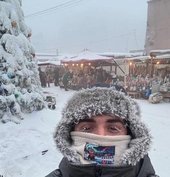 Frost-covered face at a winter market in the extreme cold