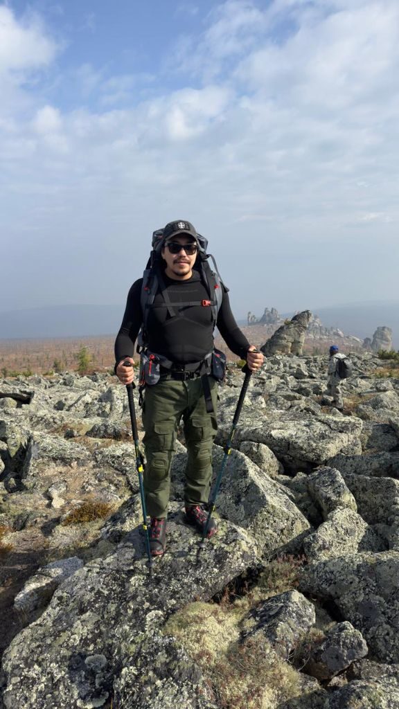 Hiker among the Kisilyakh stone formations